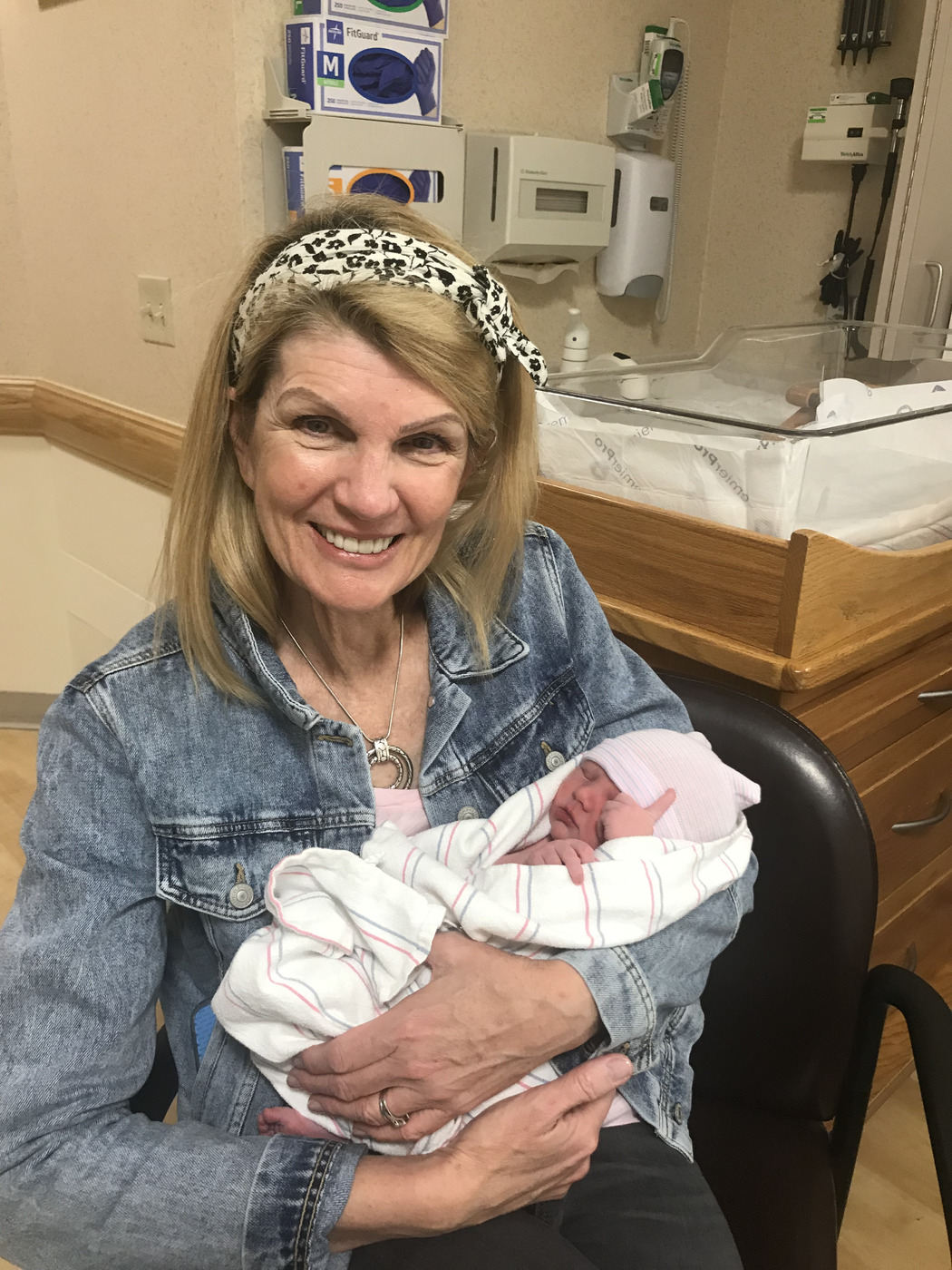 Valerie Infranco holding a newborn